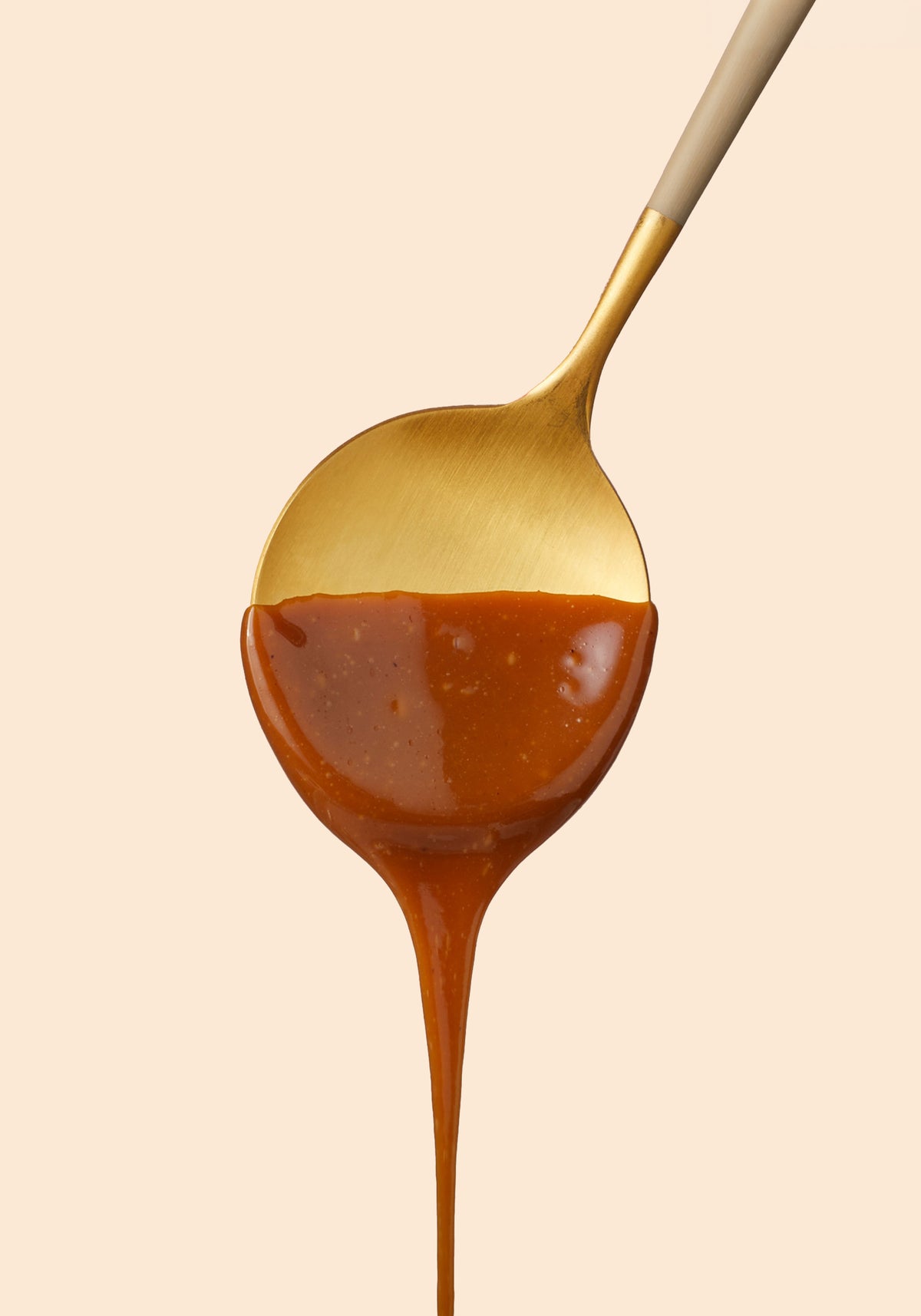 Fraktals Caramel dripping off of spoon